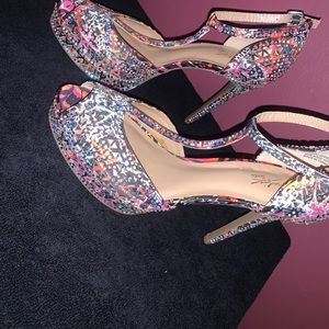 Multi-colored size 10 open toe heel.